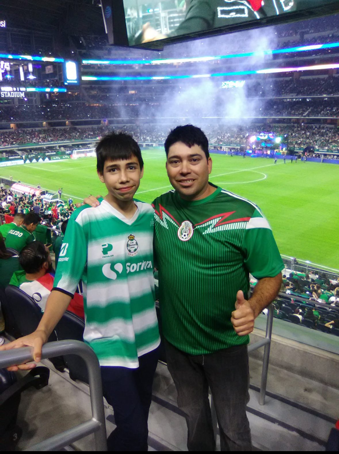 Lorenzo and his father at a soccer match in Houston