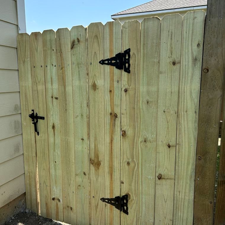 New wood gate with black hinges and latch