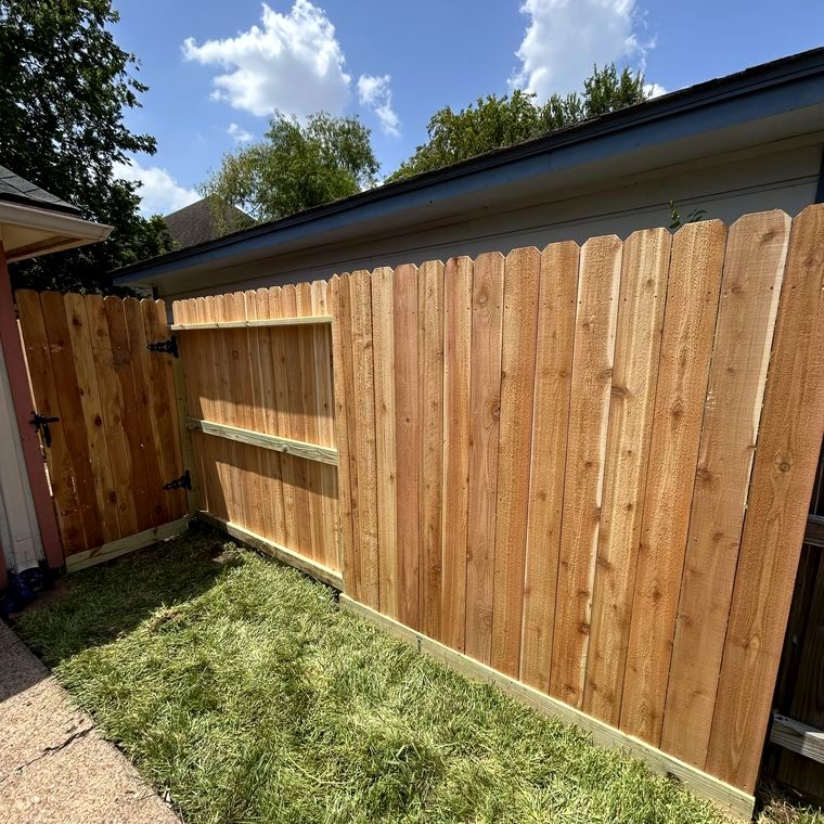 Fence and gate along a side yard