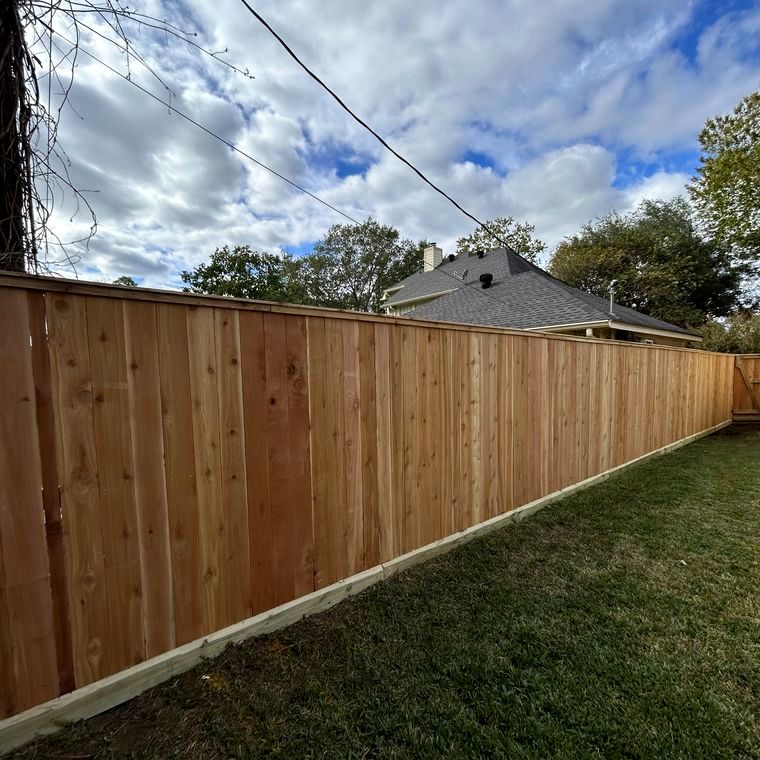 Long cedar fence run finished